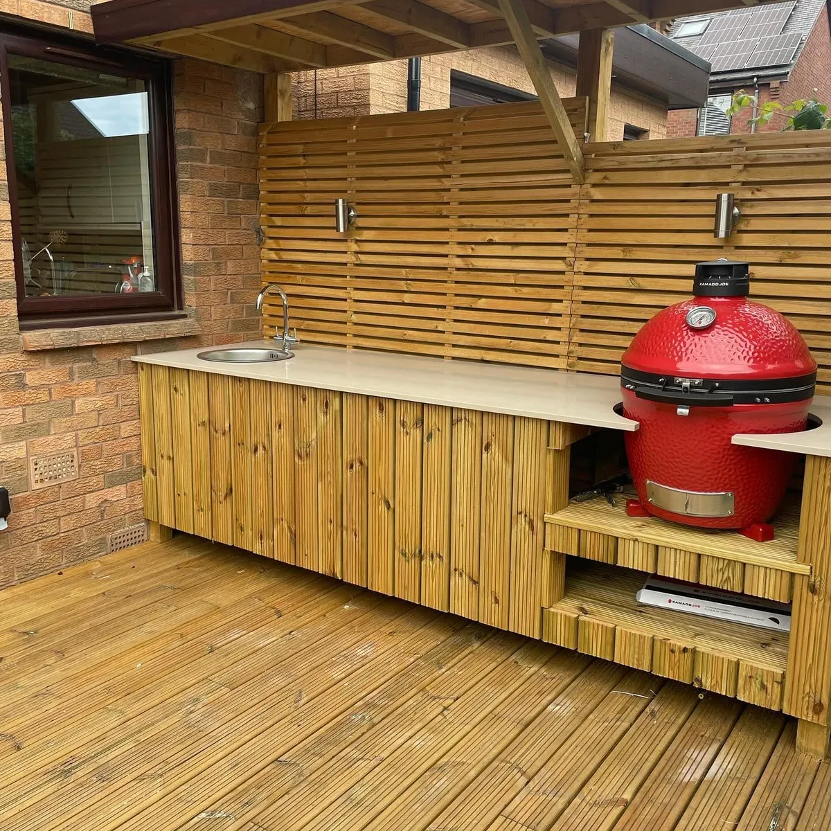 A custom-built outdoor kitchen and deck